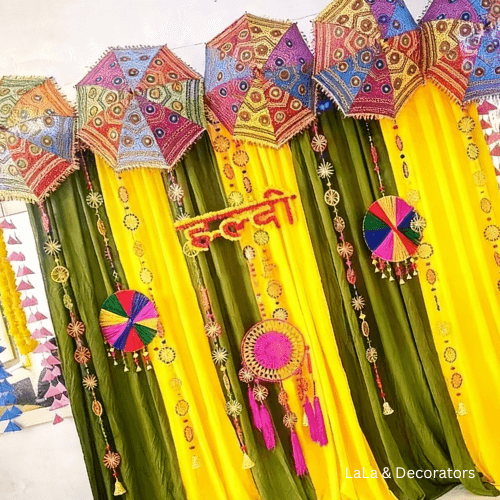 Haldi Decoration with Colorful Umbrellas & Marigold Drapes 3