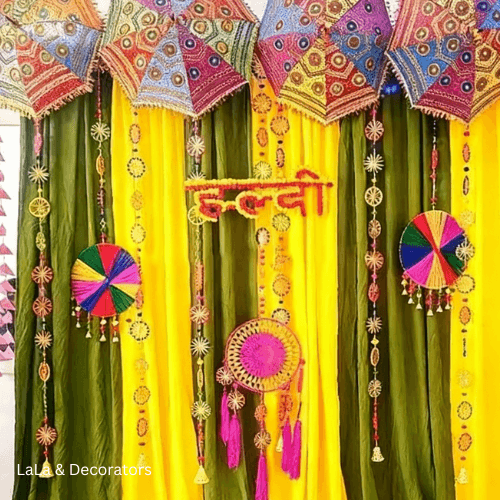 Haldi Decoration with Colorful Umbrellas & Marigold Drapes 2